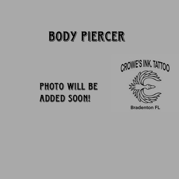A fully certified and experienced body piercing professional working at Crowes Ink Tattoo Studio in Bradenton